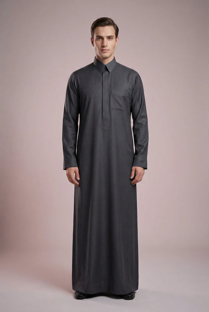 Front view of Charcoal Grey Signature Thobe featuring executive tailoring, hidden placket closure, structured collar, chest pocket detailing, and rich charcoal grey color. Premium Saudi thobe for men, luxury Islamic clothing, men's jubba, ثوب سعودي رجالي, ثوب رسمي فاخر, جلابية رجالية كلاسيكية, دشداشة رجالية حديثة, perfect for Eid, Jummah prayer, weddings, corporate gatherings, and upscale daily wear.
