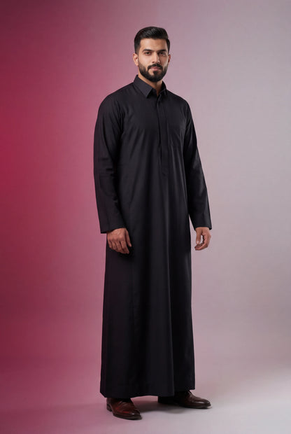 Deep Black Classic Thobe Timeless Authority featuring a sharp silhouette, concealed placket, premium fabric, elegant collar, and modern Saudi tailoring. Luxury black thobe, premium jubba, Saudi menswear, ثوب أسود رسمي, ثوب سعودي فاخر, ثوب رجالي أنيق, جلابية رجالية فخمة, دشداشة رجالية راقية, premium Islamic clothing for Eid, Ramadan, Friday prayer, business meetings, and special occasions.