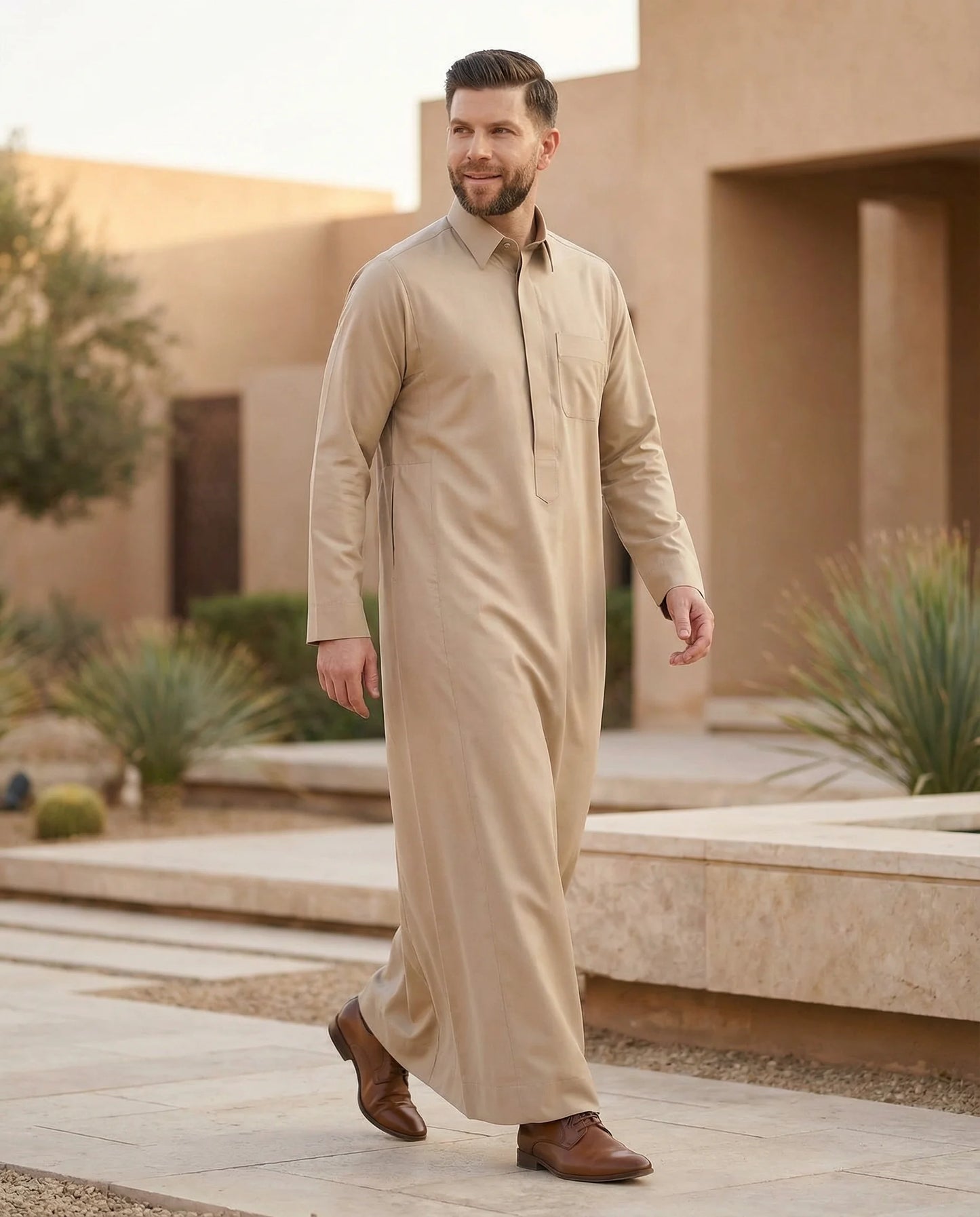 Desert Beige Classic Thobe Timeless Warm Elegance styled in a luxury desert-inspired residential setting, showcasing premium Islamic menswear with timeless elegance and refined comfort. Luxury Saudi thobe, men's designer thobe, premium jubba, ثوب سعودي فاخر للرجال, ثوب بيج صحراوي, ثوب رجالي أنيق, ثوب عربي فاخر, جلابية رجالية فخمة, دشداشة رجالية راقية, ملابس إسلامية رجالية, premium modest fashion designed for professionals, Ramadan, Eid, family gatherings, prayer, and elevated everyday living across Saudi Ar