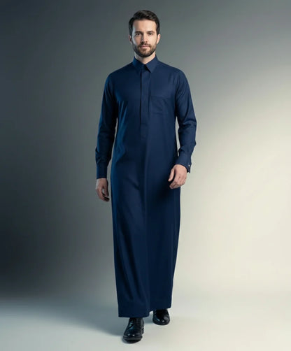 Walking view of Midnight Blue Premium Formal Thobe showcasing confident style, breathable comfort, executive tailoring, concealed placket, and timeless formal sophistication for modern gentlemen. إطلالة أثناء المشي لثوب أزرق ليلي فاخر تبرز الأناقة العصرية والراحة العالية والخياطة المتقنة للرجل الواثق والأنيق.