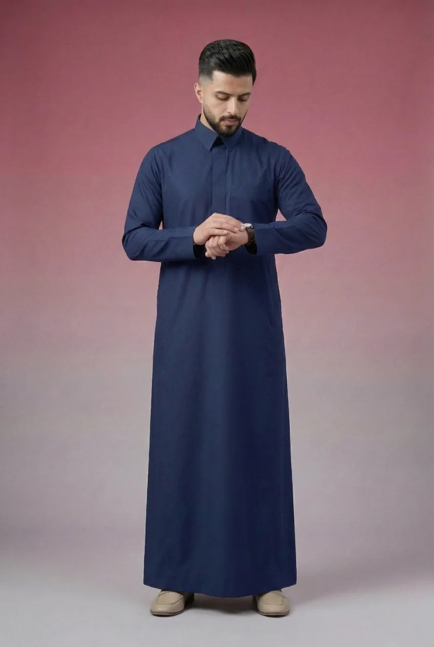 Navy Blue Classic Thobe Confident Everyday Authority featuring premium tailoring, structured collar, concealed placket, and breathable fabric with a refined professional appearance. Luxury Saudi thobe, men's Islamic clothing, premium jubba, ثوب سعودي رجالي, ثوب أزرق بحري فاخر, ثوب رسمي للرجال, جلابية رجالية كلاسيكية, دشداشة رجالية حديثة, elegant modest fashion suitable for Jummah prayer, business meetings, Eid events, family gatherings, and everyday confidence.