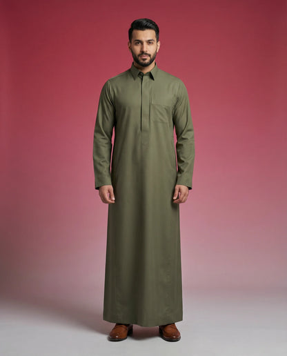 Olive Green Premium Thobe Timeless Structured Fit featuring concealed front placket, premium tailoring, breathable luxury fabric, elegant shirt collar, and sophisticated Saudi-inspired design. Luxury Saudi thobe, men's Islamic clothing, premium jubba, ثوب سعودي رجالي, ثوب أخضر زيتوني فاخر, ثوب رسمي للرجال, جلابية رجالية كلاسيكية, دشداشة رجالية حديثة, modest fashion ideal for Jummah prayer, work, Eid celebrations, Ramadan gatherings, and everyday sophistication.