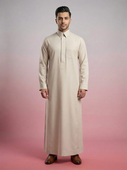 Pearl Beige Classic Thobe Refined Everyday Elegance featuring concealed front placket, premium tailoring, breathable luxury fabric, elegant shirt collar, and timeless Saudi-inspired design. Luxury Saudi thobe, men's Islamic clothing, premium jubba, ثوب سعودي رجالي, ثوب بيج لؤلؤي فاخر, ثوب رسمي للرجال, جلابية رجالية كلاسيكية, دشداشة رجالية حديثة, modest fashion ideal for Jummah prayer, work, Eid celebrations, Ramadan gatherings, and everyday sophistication.
