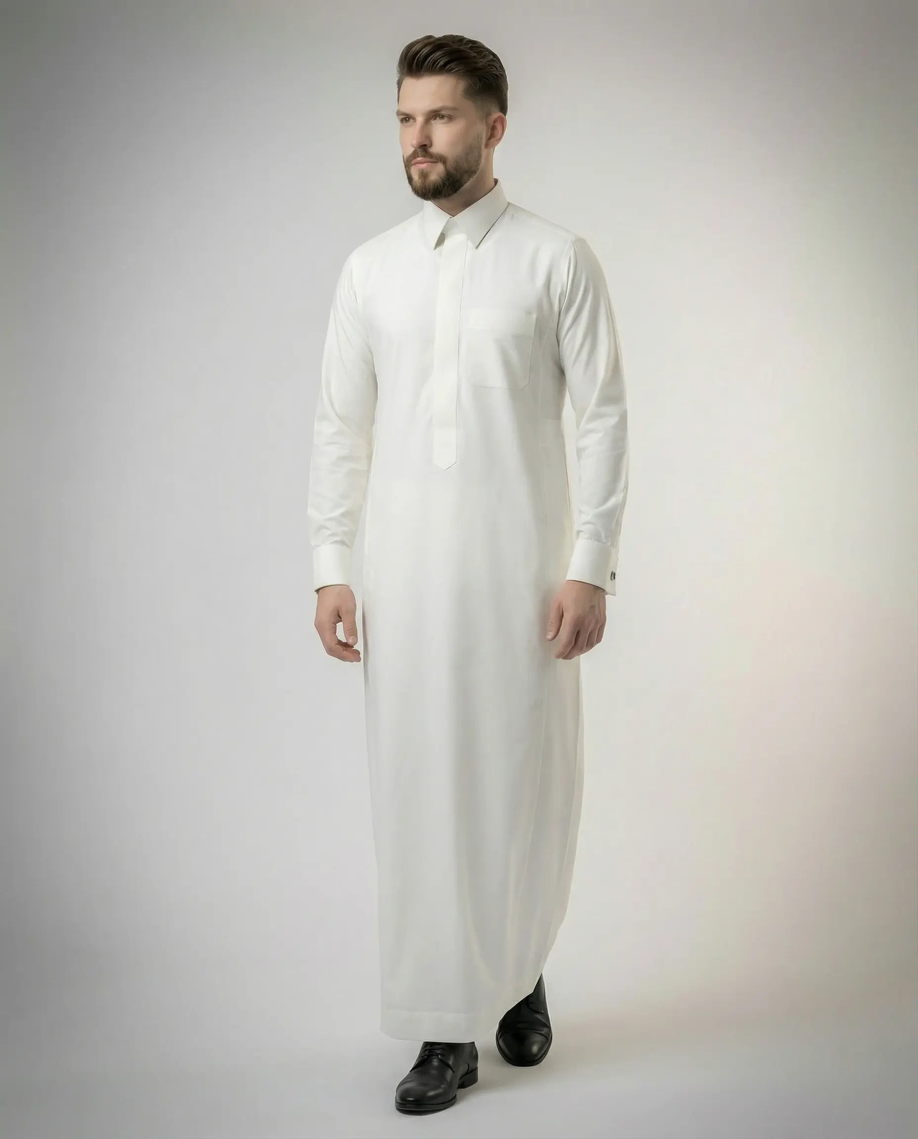 Pearl White Premium Formal Thobe worn by a male model in a front walking pose, featuring luxury tailoring, concealed placket, formal collar, premium fabric, and modern executive styling.