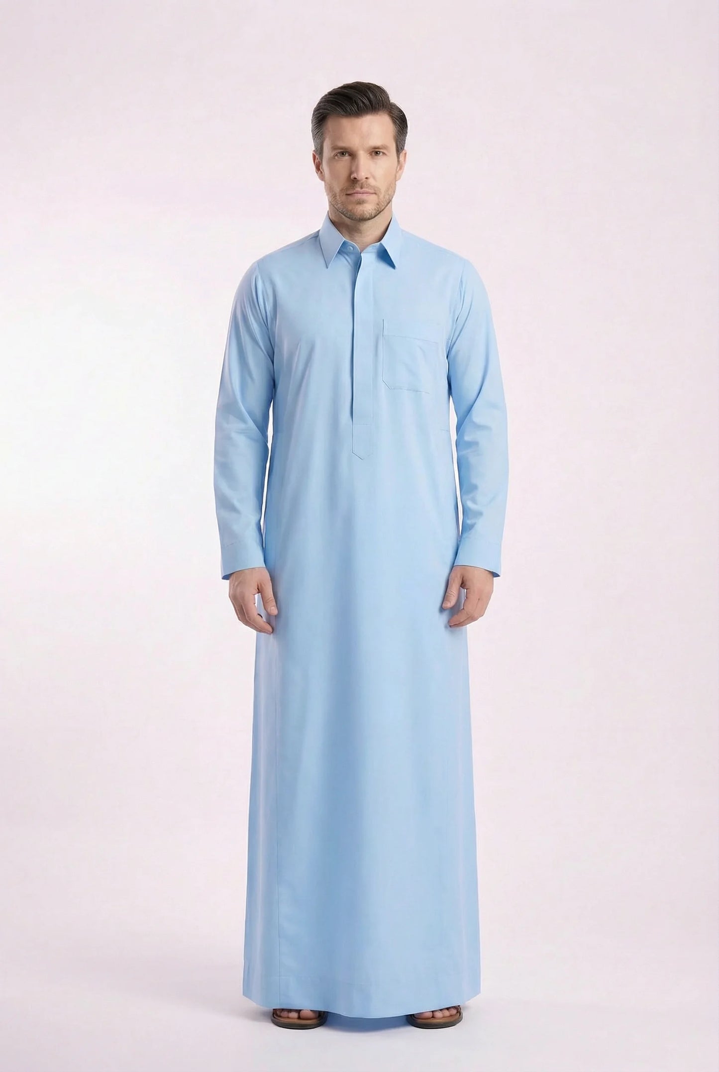 Side profile of Sky Blue Classic Everyday Thobe highlighting modern tailoring, streamlined silhouette, structured collar, and lightweight breathable fabric. Luxury men's thobe, Saudi jubba, Arabic clothing, ثوب سعودي أنيق, ثوب رجالي فاخر, ثوب أزرق فاتح, دشداشة رجالية رسمية, جلابية رجالية مودرن, premium Islamic menswear crafted for professional environments, Ramadan evenings, Eid celebrations, and elevated daily wear.