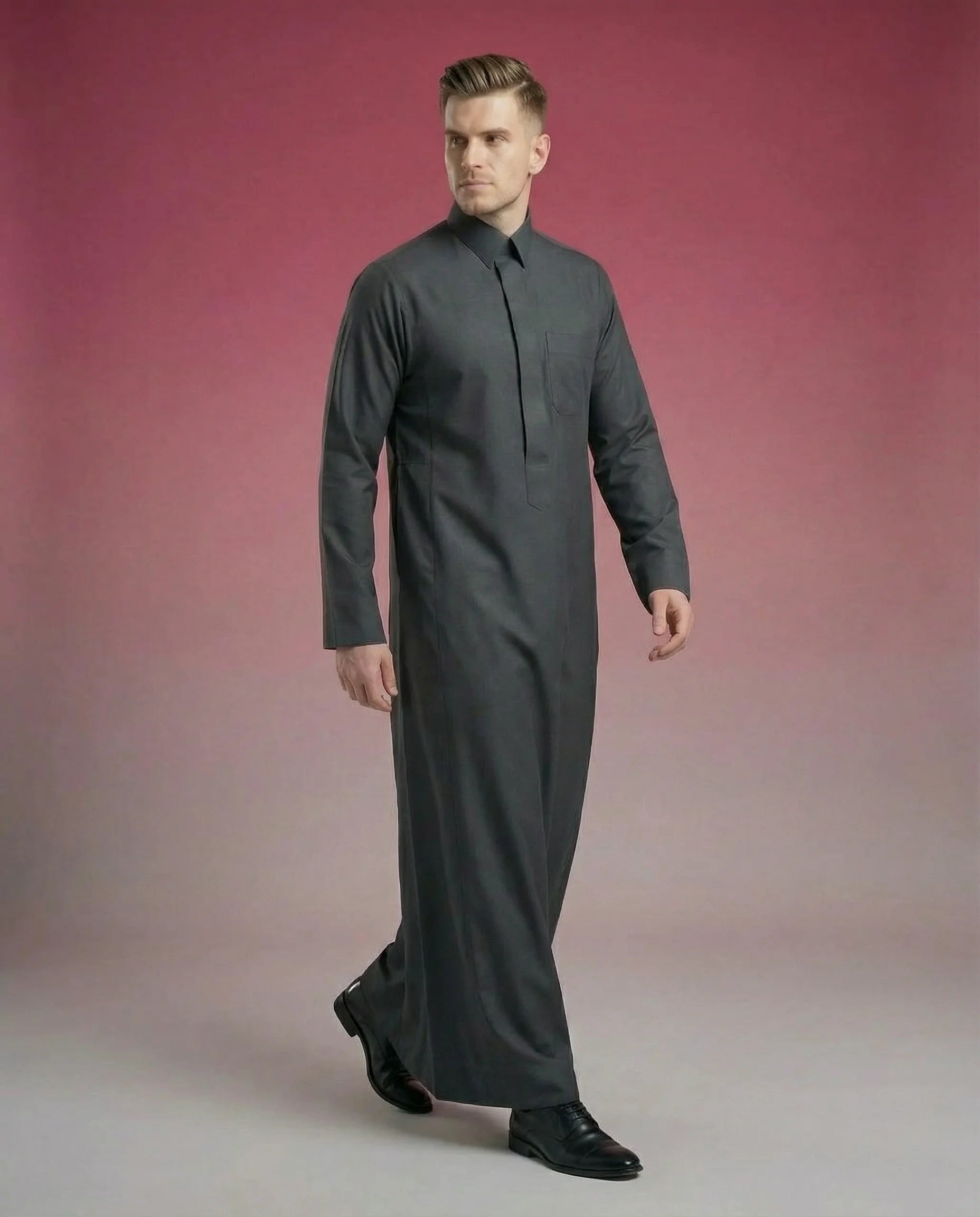 Smoke Black Classic Thobe Premium Everyday Wear featuring concealed front placket, premium tailoring, breathable fabric, elegant shirt collar, and modern Saudi-inspired design. Luxury Saudi thobe, men's Islamic clothing, premium jubba, ثوب سعودي رجالي فاخر, ثوب أسود كلاسيكي, ثوب فحمي أنيق, ثوب رسمي للرجال, جلابية رجالية كلاسيكية, دشداشة رجالية حديثة, modest fashion ideal for Jummah prayer, work, Eid celebrations, Ramadan gatherings, and everyday sophistication.