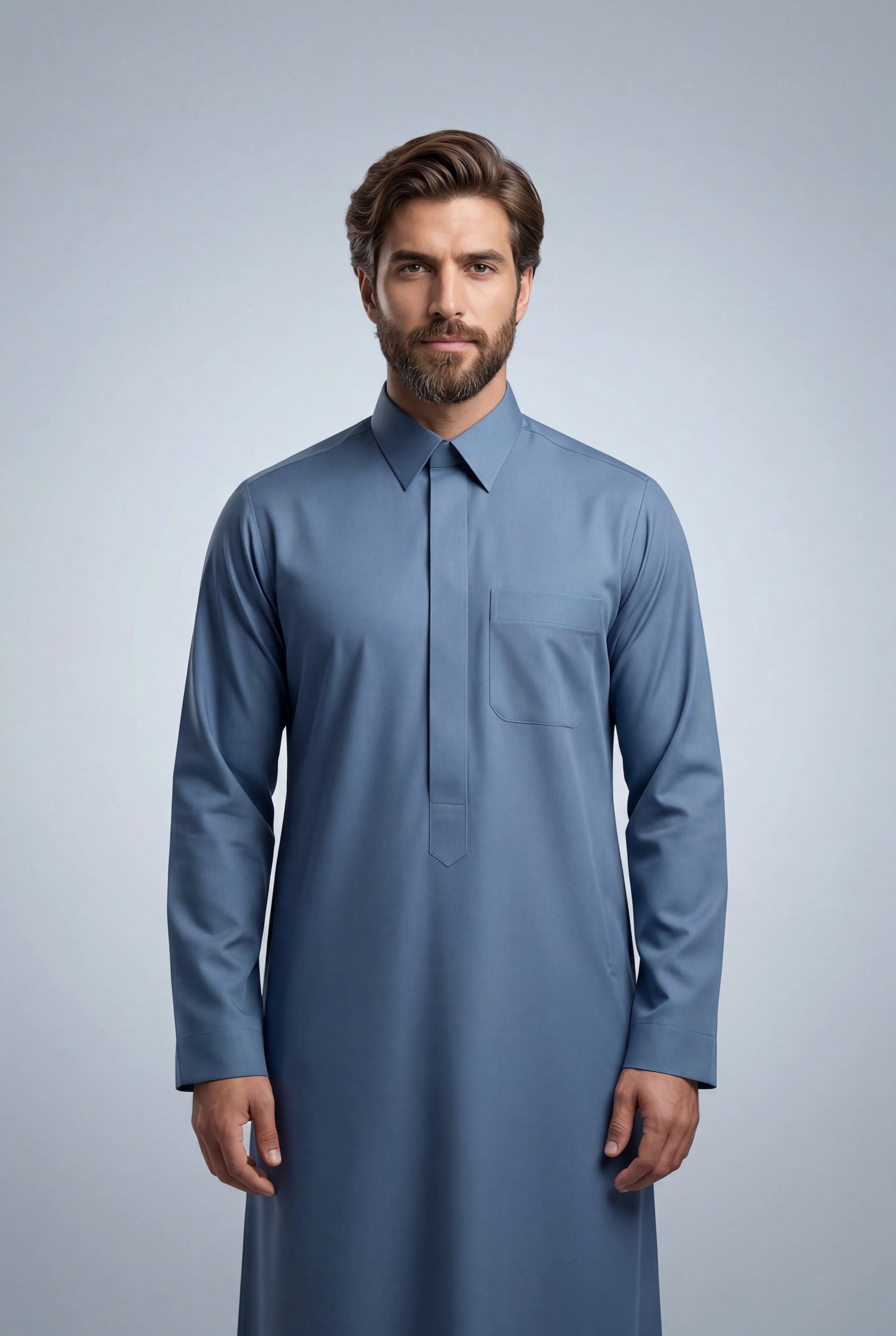 Front view of Steel Blue Classic Thobe featuring executive tailoring, concealed front placket, chest pocket, premium steel blue fabric, and modern everyday confidence silhouette. Saudi thobe for men, luxury Islamic clothing, premium jubba, ثوب سعودي رجالي, ثوب أزرق فولاذي فاخر, ثوب رسمي للرجال, جلابية رجالية كلاسيكية, دشداشة رجالية حديثة, elegant modest fashion suitable for Jummah prayer, weddings, professional meetings, Eid events, and refined everyday occasions.