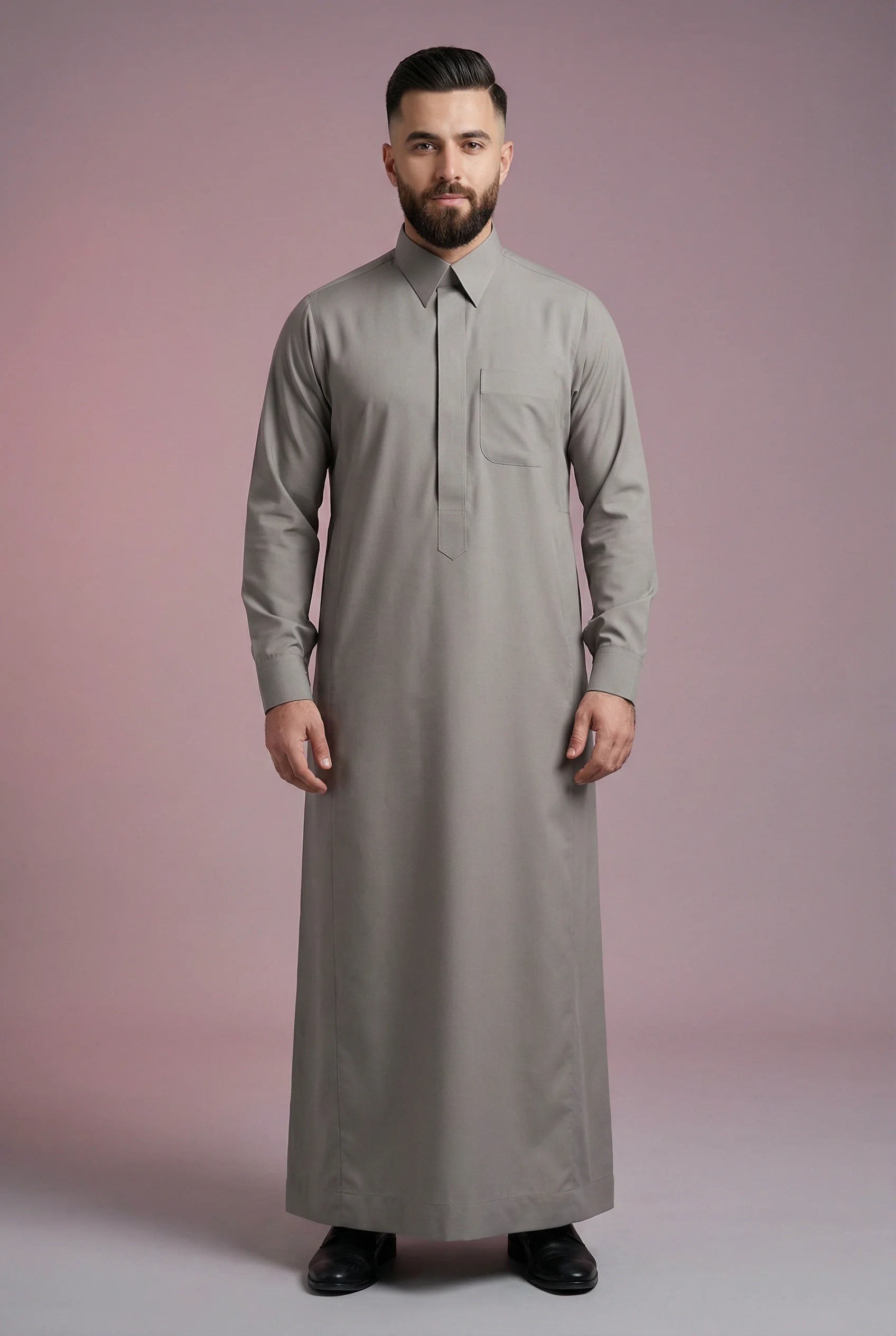 Front view of Urban Stone Grey Classic Saudi Thobe featuring a tailored fit, concealed placket, sharp collar design, practical chest pocket, and sophisticated neutral tone. Premium men's thobe ideal for business-casual styling, Eid celebrations, mosque visits, and daily wear.