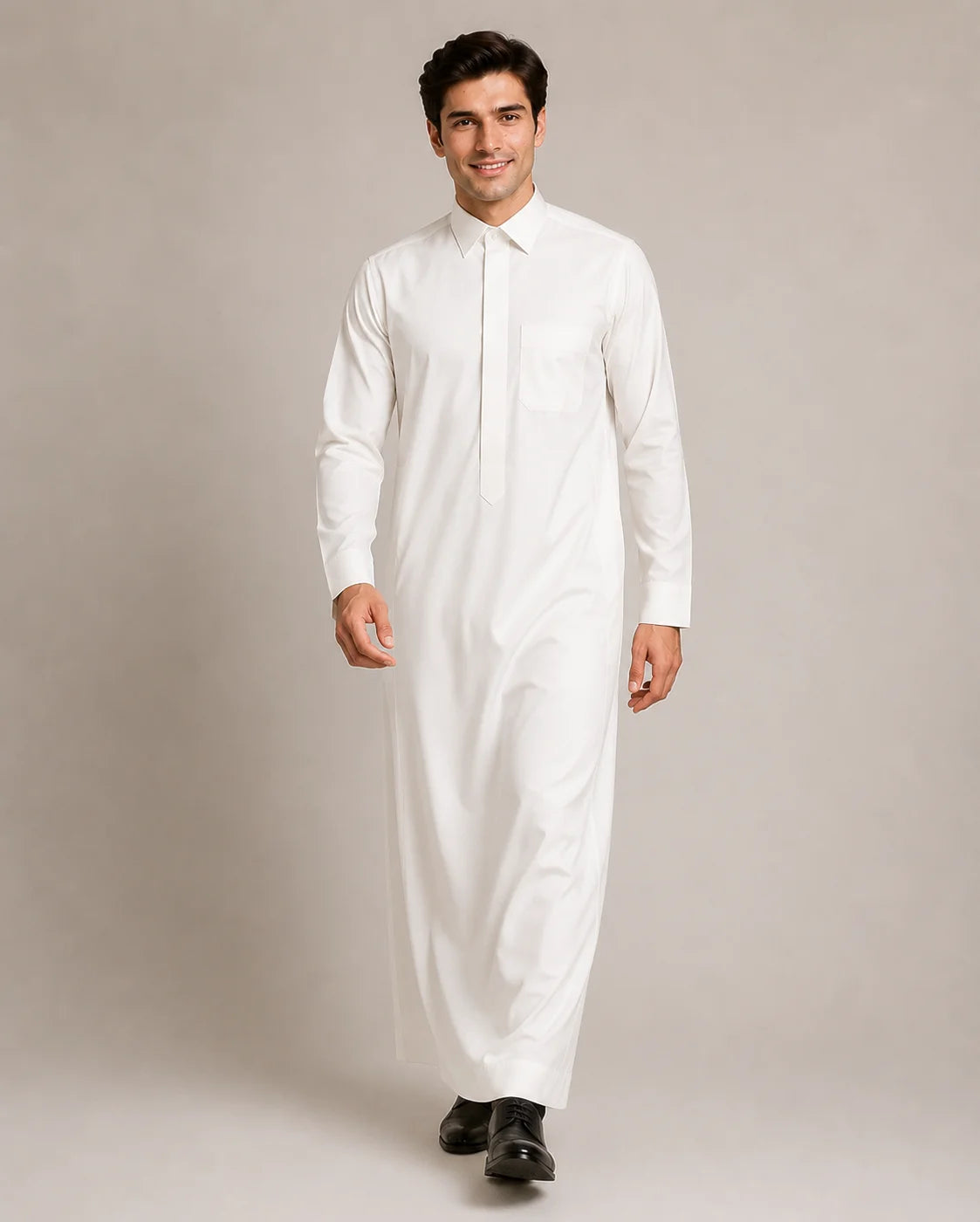 Man walking in Pearl White Classic Saudi thobe showcasing modern elegance, premium craftsmanship and comfortable everyday wear