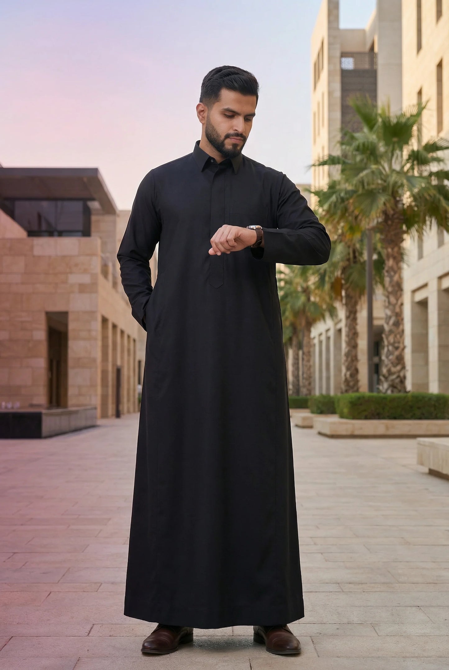 Deep Black Classic Thobe styled in a luxury urban setting, showcasing confidence, authority, and timeless elegance. Premium Saudi thobe, luxury men's jubba, Islamic menswear, ثوب أسود فاخر للرجال, ثوب سعودي أنيق, ثوب رجالي رسمي, جلابية رجالية راقية, دشداشة رجالية فاخرة, ملابس إسلامية رجالية, premium modest fashion suitable for professionals, Ramadan, Eid, prayer, family gatherings, and elevated everyday wear.