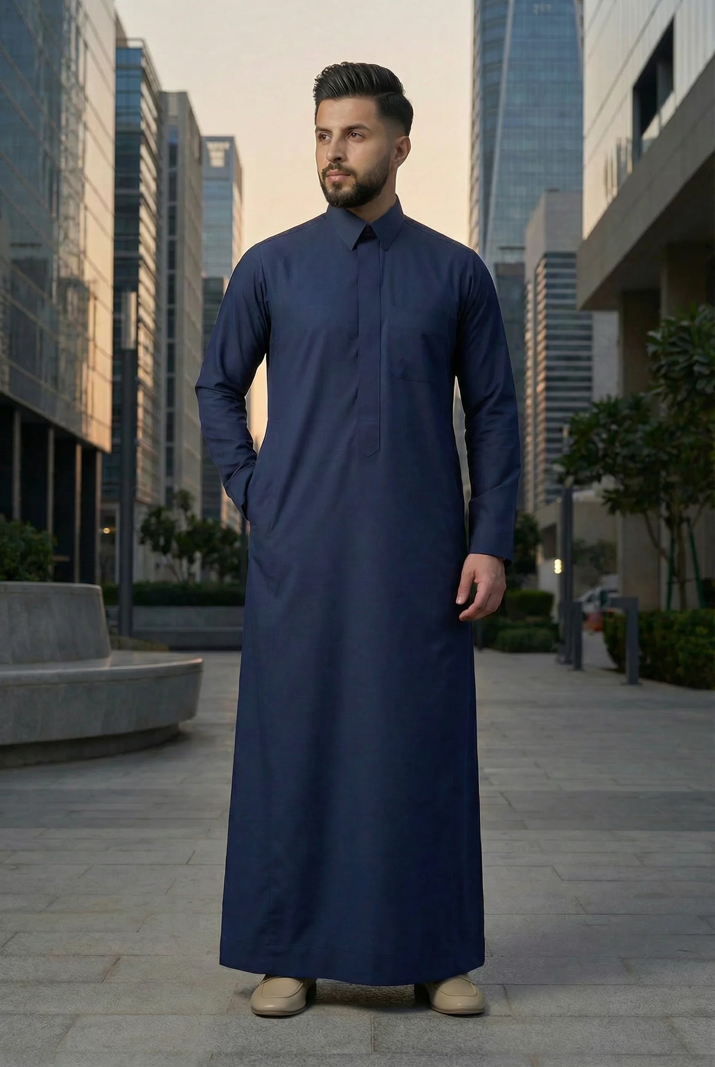 Navy Blue Classic Thobe Confident Everyday Authority styled in a modern urban environment, showcasing premium Islamic menswear with timeless Arab elegance and confident professional style. Luxury Saudi thobe, men's designer thobe, premium jubba, ثوب سعودي فاخر للرجال, ثوب أزرق بحري, ثوب كحلي رجالي, ثوب رجالي أنيق, جلابية رجالية فخمة, دشداشة رجالية راقية, ملابس إسلامية رجالية, ثوب يومي فاخر, modest fashion designed for professionals seeking authority, comfort, elegance, and versatility throughout Ramadan, Ei