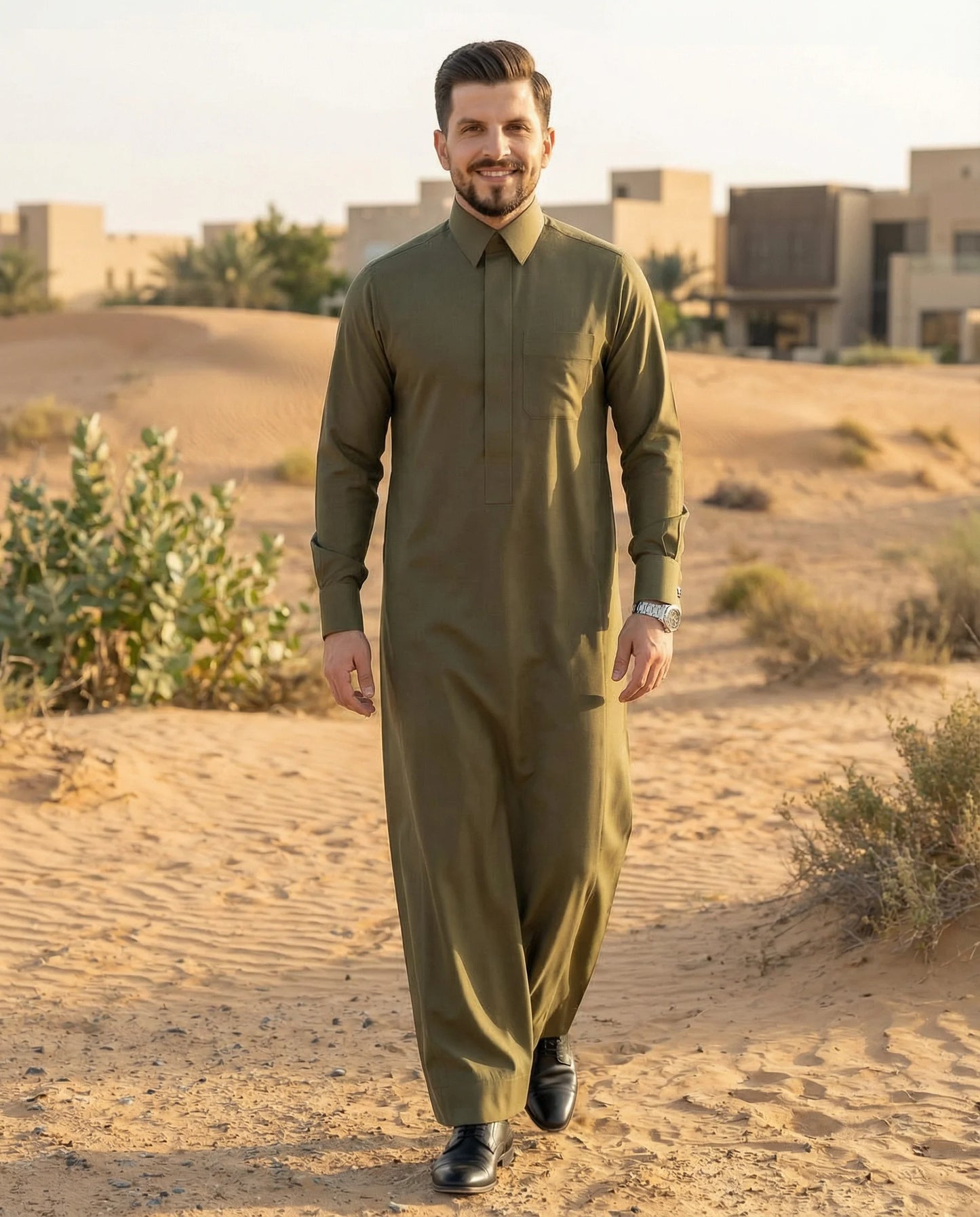 Olive Green Premium Formal Thobe styled in a luxury desert-inspired Gulf setting, combining contemporary elegance, premium craftsmanship, refined tailoring, and sophisticated formal fashion for modern gentlemen seeking distinction and confidence. ثوب أخضر زيتوني فاخر بإطلالة مستوحاة من البيئة الخليجية الراقية يجمع بين الفخامة العصرية والأناقة الكلاسيكية والراحة للرجل المتميز.